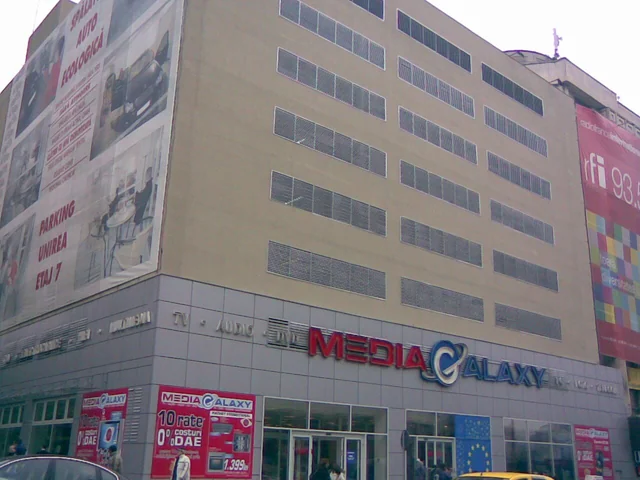 Unirea parking facade with rows of installed metal louvers.